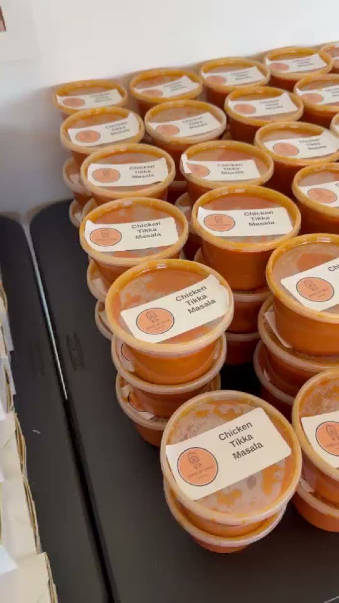 Individual Indian meal portions packed and labelled for a large office order